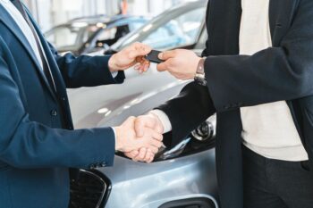 Car concierge buying advisor handing over keys to a busy professional in Atlanta