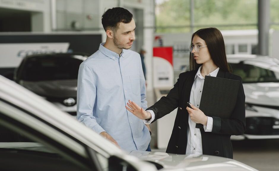 Car buying concierge service advisor helping a customer review vehicle options at a North Georgia dealership