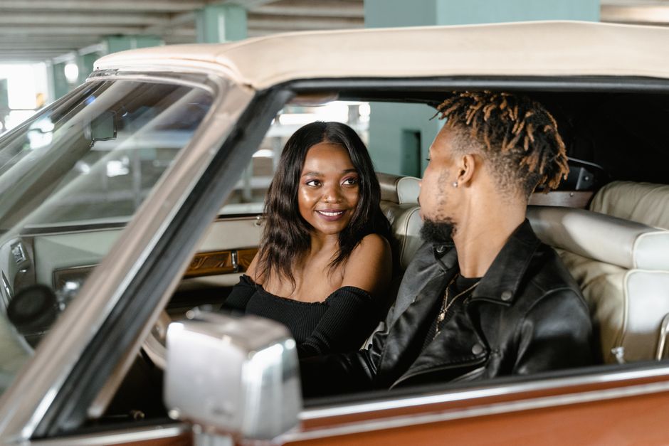 Couple browsing a used car lot in north Georgia while considering buy here pay here options